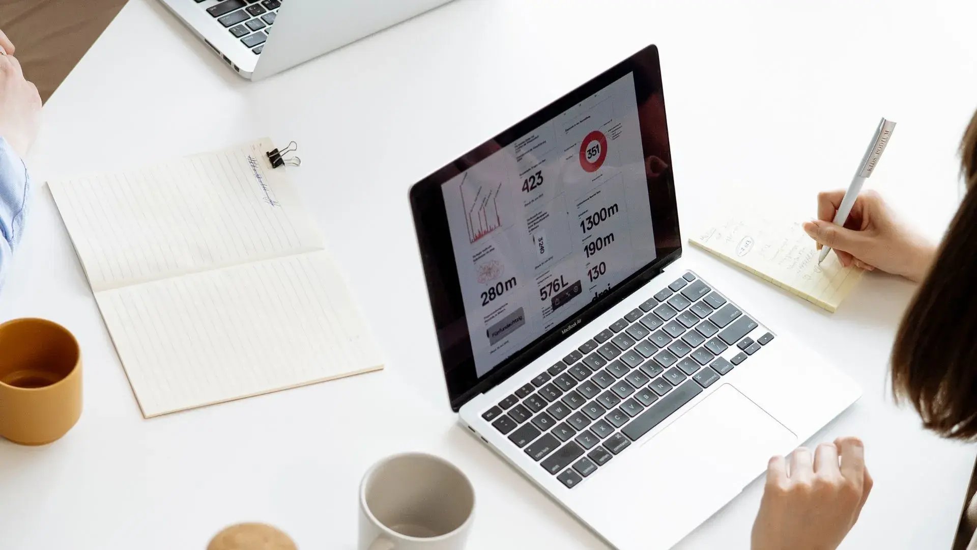 Two laptop screen featured, one screen with numbers referring to security awareness