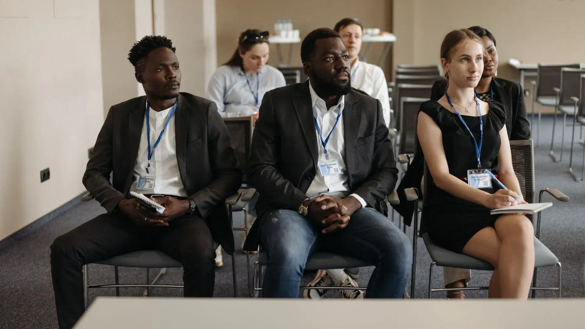 A group of employees listening intently to a security awareness training&nbsp;